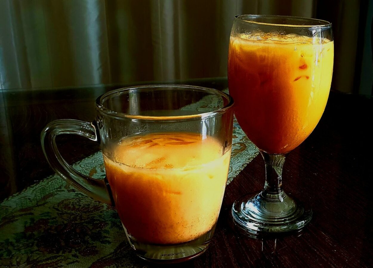 A cup of Homemade Thai Tea placed on a table. 