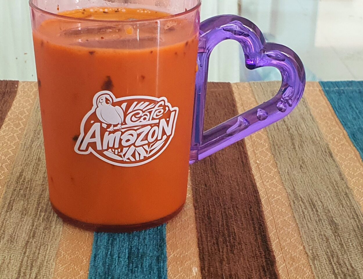  Thai Iced Tea By Café Amazon Placed On A Table