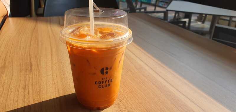 A Chilled Glass Of Thai Tea From The Coffee Club Placed On A Table