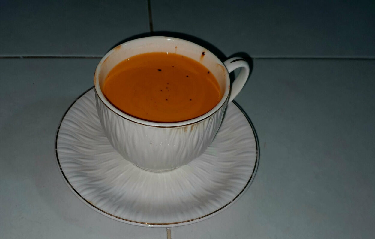 Home-Made Thai Tea Placed on a Saucer